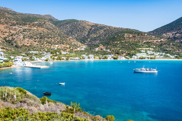 View of azure sea bay and sandy beach in Platis Gialos village, Sifnos island, Greece