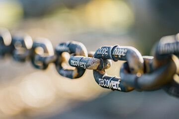 Breaking Free from Addiction with Engraved Words Like Hope and Recovery on Chain Links