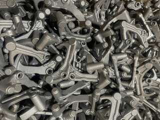 lot of iron die cast parts placed on mass, automotive parts mass production, mass production of...