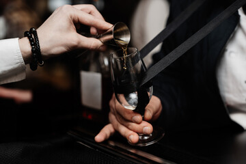 Bartender pours whiskey for tasting.