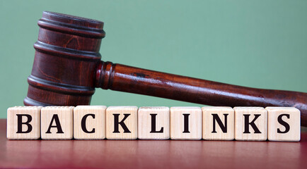 BACKLINKS - word on wooden cubes on background of judge's gavel