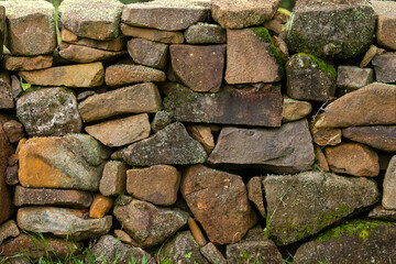 Stone wall texture with mosses and lichens