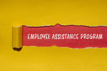 Employee assistance program words written on torn yellow paper with red background. Conceptual...