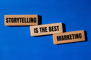 Storytelling is the best marketing words written on wooden blocks with blue background. Conceptual...