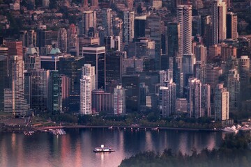 High rise buildings by the water at sunset. Drone picture of Vancouver downtown Coal Harbor. British Columbia. Canada