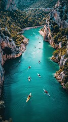 Two Kayakers Paddling in River Surrounded by Mountains