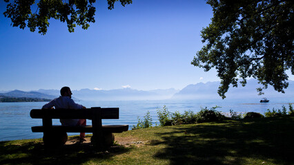 Sitting in front of the Leman lake in Lausanne, Switzerland