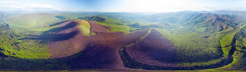 drone flies over a spring Carpathian peak with an interesting phenomenon - the mountain forest on the mountain is green up to a certain height, and above without leaves