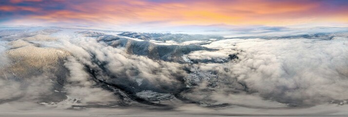 Severe frost at sunrise in the Carpathians, Transcarpathia, Ukraine. A drone flies over the tops of...