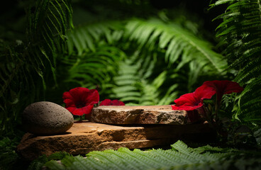 stones and red flowers for the podium