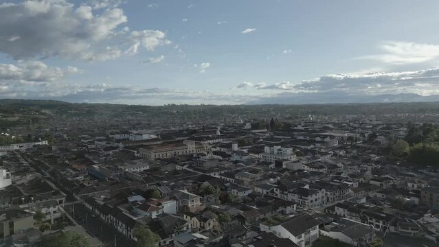 Popayan town in Colombia, close to Cali its a beautiful colonial town in white buildings and roofs that combine very good with the view from the air, drone scenes all over town and the sky, 