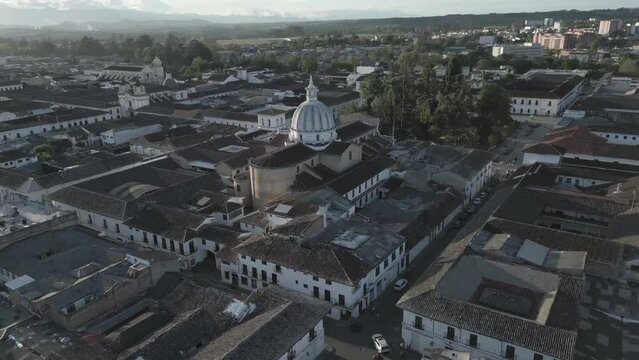 Popayan town in Colombia, close to Cali its a beautiful colonial town in white buildings and roofs that combine very good with the view from the air, drone scenes all over town and the sky, 