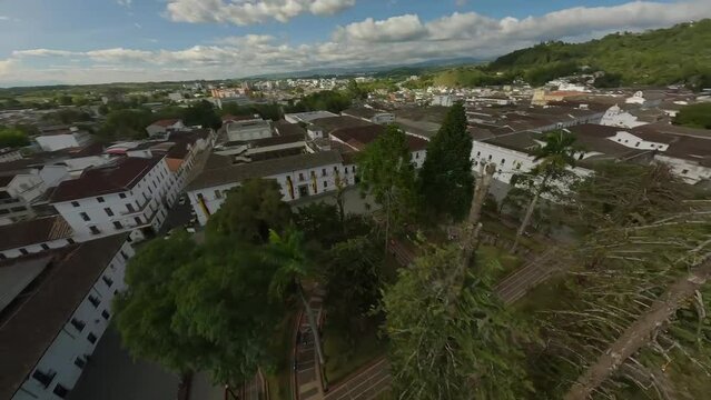 Popayan town in Colombia, close to Cali its a beautiful colonial town in white buildings and roofs that combine very good with the view from the air, drone scenes all over town and the sky, 