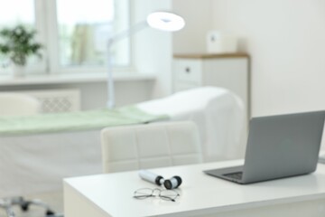 Modern interior of dermatologist's office with examination table