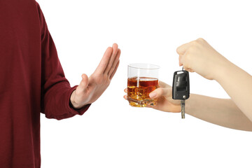 Man refusing alcoholic drink while woman suggesting him car keys and glass of whiskey, closeup....