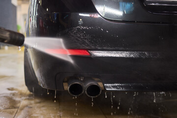 Foam covers car in garage tires, wheels, lights, hood, automotive design