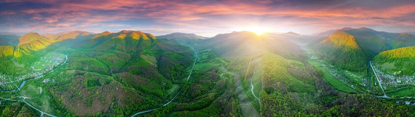 drone flies over a spring Carpathian peak with an interesting phenomenon - the mountain forest on...