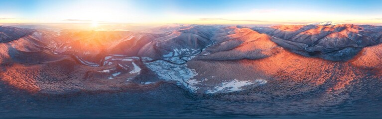 Severe frost at sunrise in the Carpathians, Transcarpathia, Ukraine. A drone flies over the tops of...