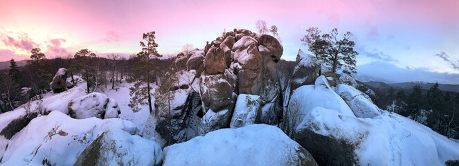 Dovbush rocks in winter in Bubnyshche, Carpathians, Ukraine, Europe. Huge stone giants rise in the snowy transparent beech forest, all-round panoramic views are unique without leaves