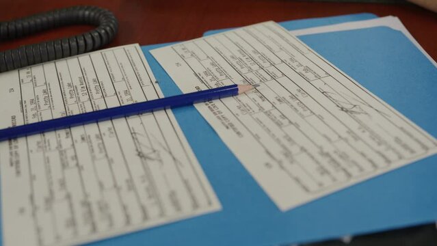 Police officer doing data entry in precinct
