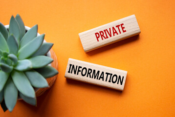 Private Information symbol. Wooden blocks with words Private Information. Beautiful orange...