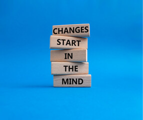Changes start in the Mind symbol. Wooden blocks with words Changes start in the Mind. Beautiful...