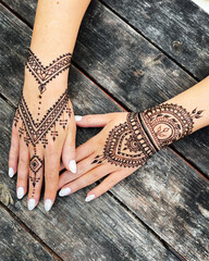 Exquisite henna tattoo on hands with intricate mandala and geometric patterns, ideal for cultural...