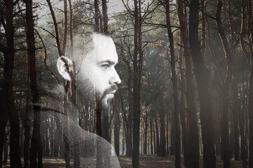 Double exposure of thoughtful man and trees