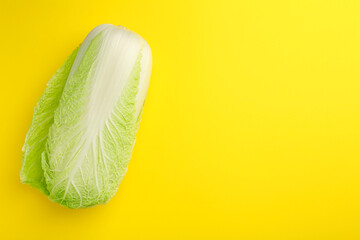 Fresh ripe Chinese cabbage on yellow background, top view. Space for text