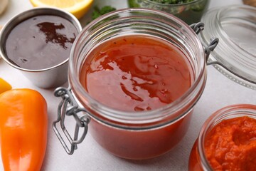Different marinades in tableware on table, closeup
