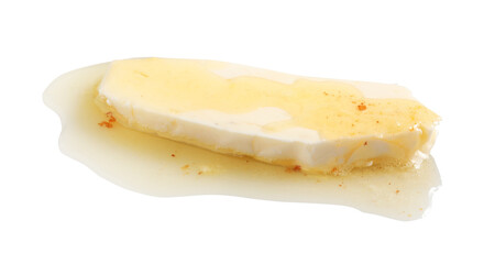 Piece of melting butter on white background