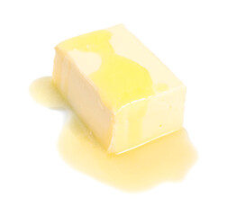 Piece of melting butter on white background