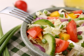 Tasty salad with Chinese cabbage in bowl on table, closeup