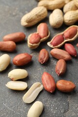 Obraz premium Fresh peanuts on grey table. Healthy snack