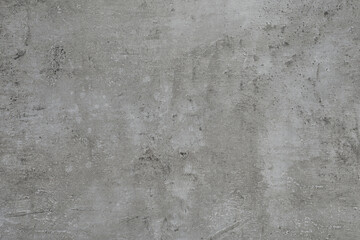 Grey concrete textured surface as background, closeup