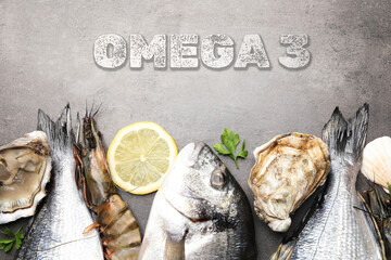 Fresh seafood rich in Omega 3 oils on grey table, flat lay
