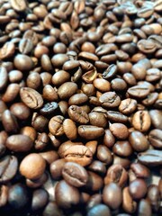 A closeup of coffee beans, showcasing their rich color and texture.