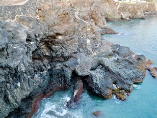 Sunset on the frozen lava coast at Punta Delioma, Las Galletas, Arona, Tenerife, Atlantic Ocean, Canary Islands, Spain