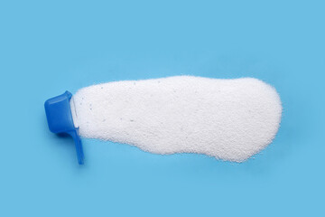 Detergent powder with measuring spoon. Laundry concept.