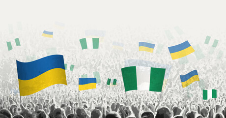 People waving flag of Nigeria and Ukraine, symbolizing Nigeria solidarity for Ukraine.