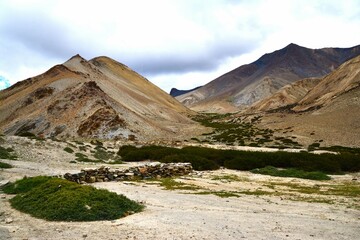View of picturesque mountain landscape as seen from the hiking trail crossing the Ganda La pass (4980 m) and leading to Markha valley (Hemis National Park, Ladakh, India)