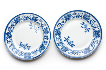 Two blue and white plates with flowers on them