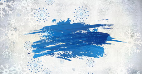 Blue brush stroke stands out against snowy backdrop with snowflakes