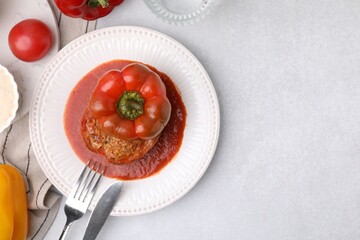 Delicious stuffed bell pepper served on light table, flat lay. Space for text