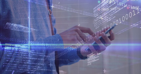 Data processing and blue light trails against mid section of a man using smartphone