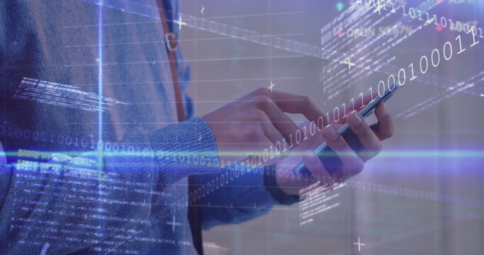 Data processing and blue light trails against mid section of a man using smartphone