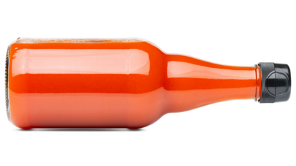 Hot Sauce. Hot chili sauce bottle. Liquid tasty spice ketchup for barbecue or barbeque. BBQ sauce for cooking. Glass bottle tomato paste. Red hot Cayenne pepper, Carolina Reaper, paprika. Food photo 
