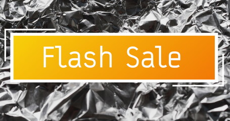 Image of flash sale text over close up of crumpled paper
