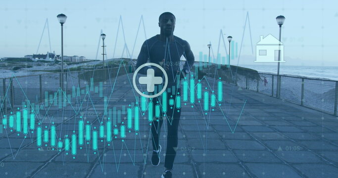 Image of graphs, icons over african american male athlete running on promenade against sky