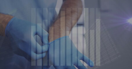 Image of statistics and financial data processing over man using smartphone